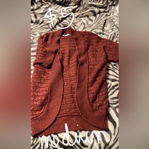Maurice’s brown/red cardigan